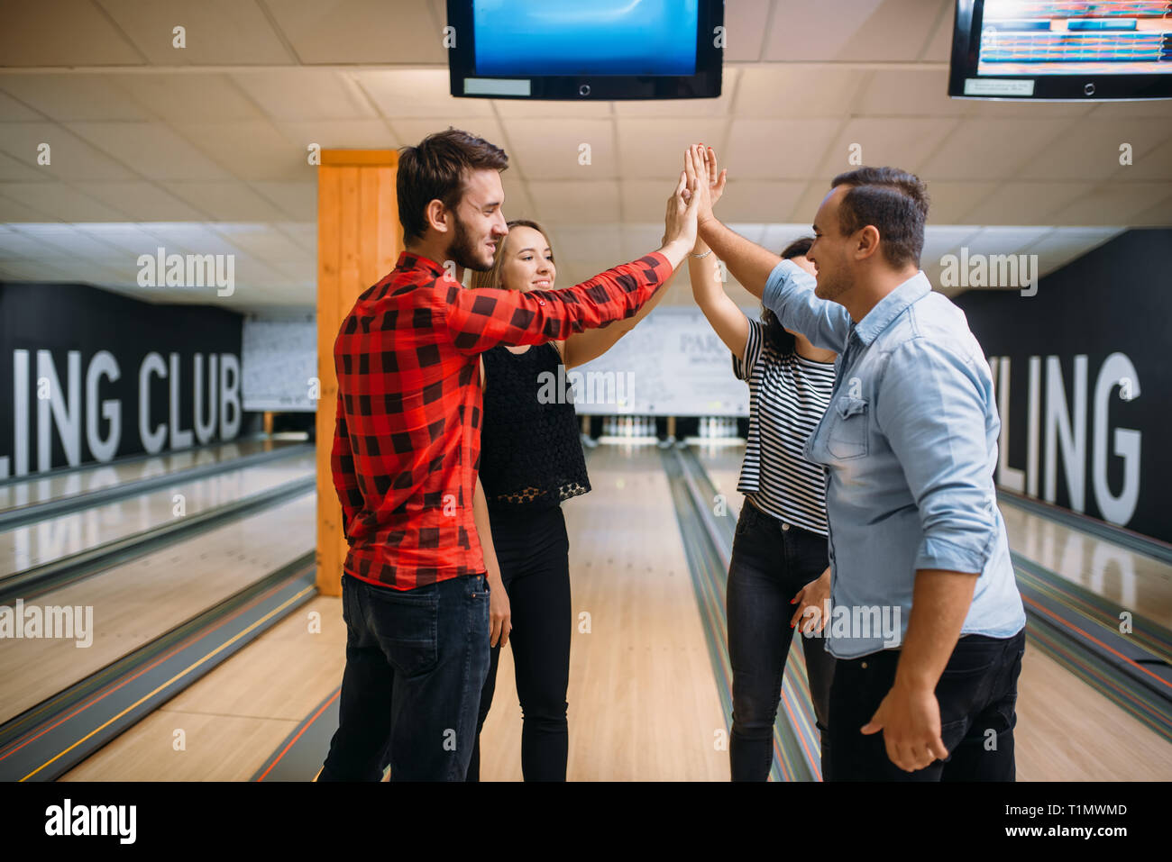 Bowling team joined hands before the competition Stock Photo