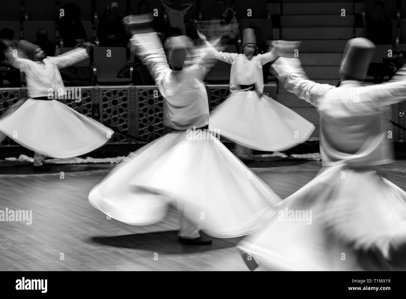 Unidentified whirling Dervishes or Semazen in Konya Stock Photo