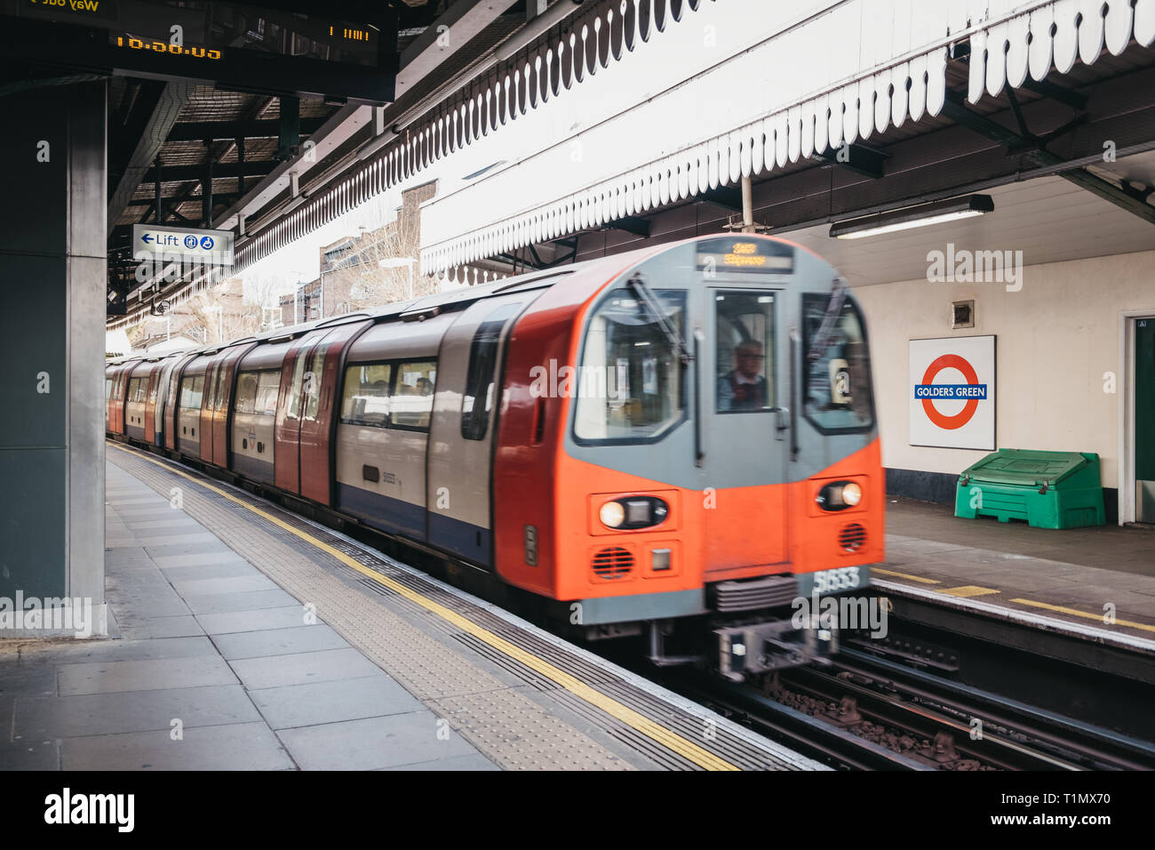 London, UK March 16, 2019 London Underground train arriving at an outdoor platform of Golders