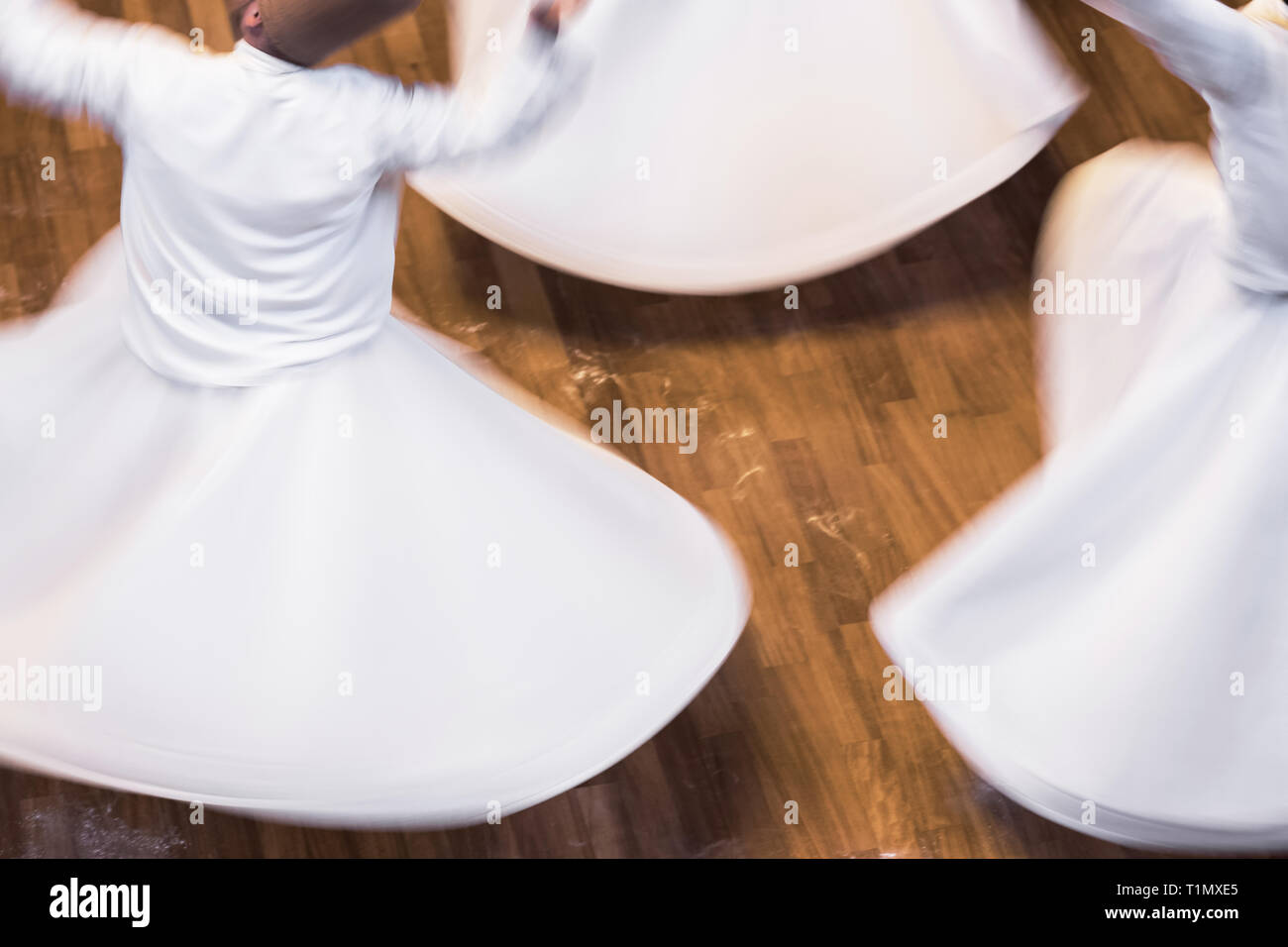 Unidentified whirling Dervishes or Semazen in Konya Stock Photo