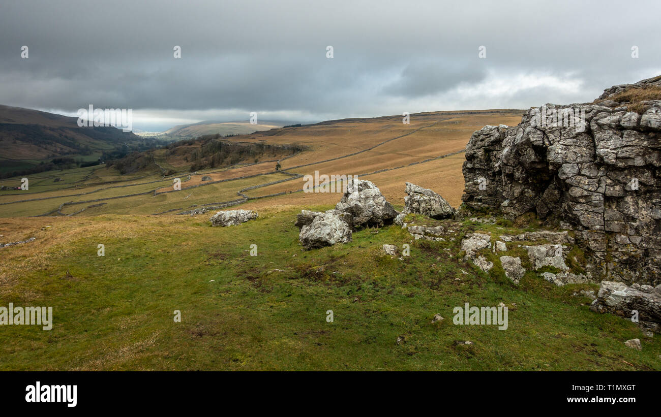 Looking north across countryside towards Kettlewell from The Pie rocky outcrop near Conistone in the Yorkshire Dales, UK Stock Photo