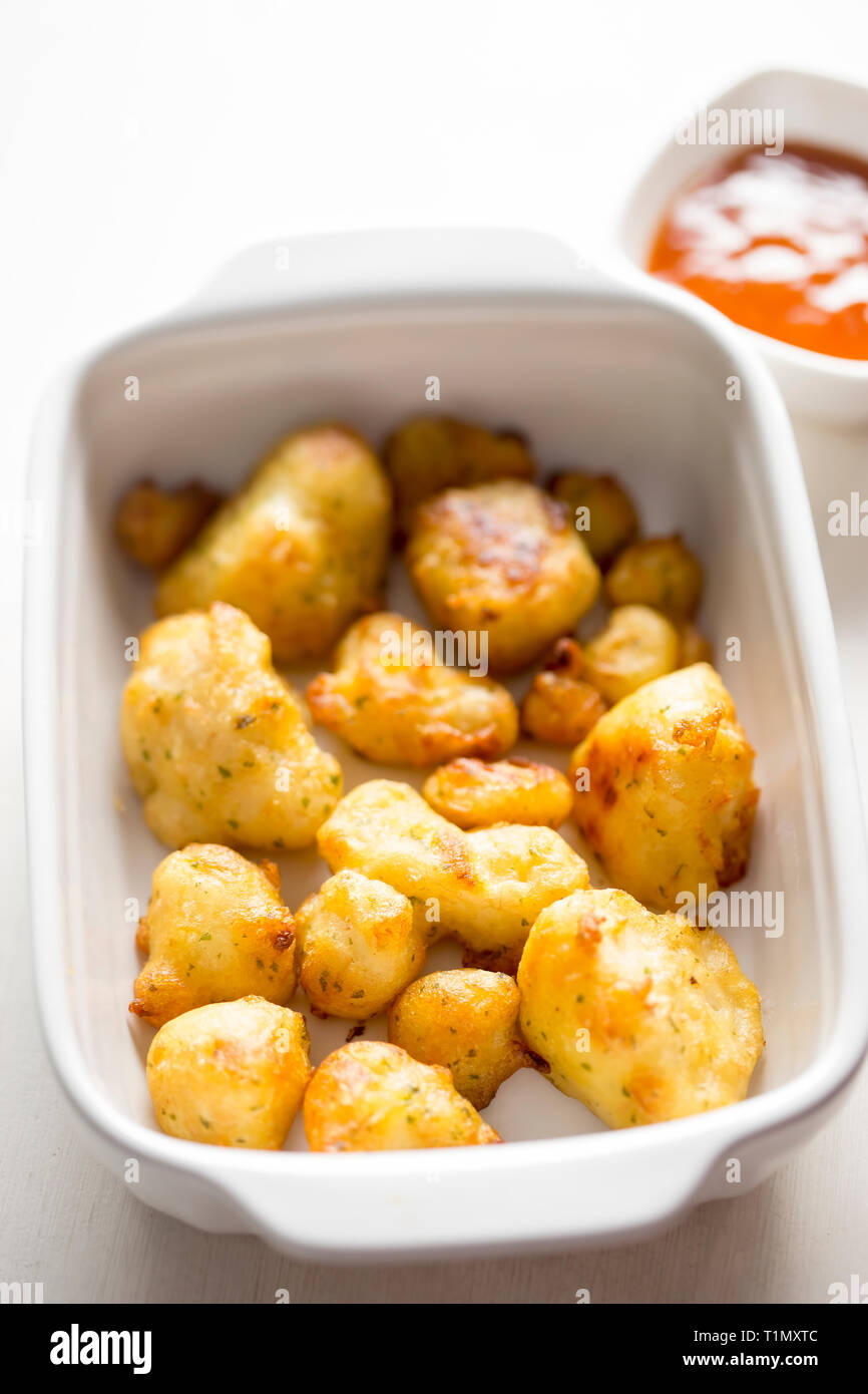Cauliflower popcorn, coated mini cauliflower florets in a light batter