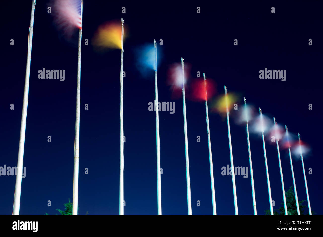 Long exposure flags. Waving flags on the wind at night. Different