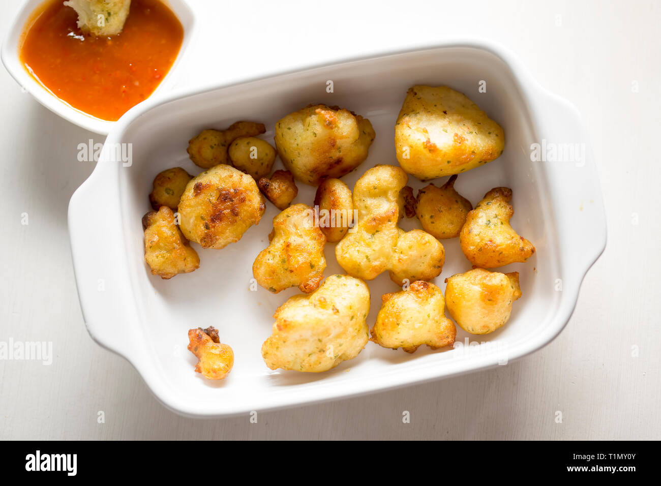 Cauliflower popcorn, coated mini cauliflower florets in a light batter