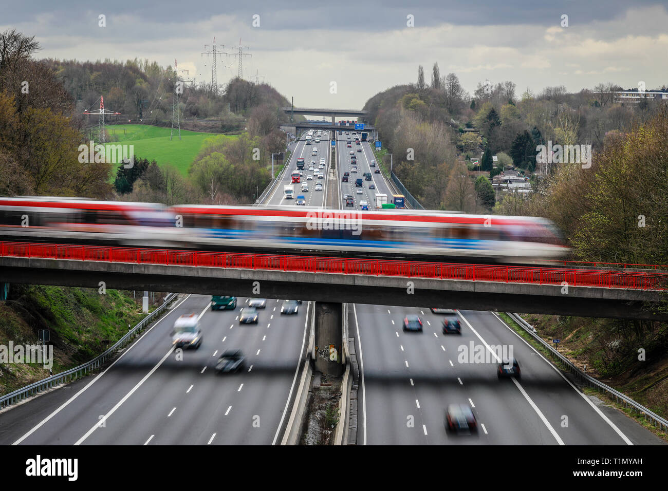 Erkrath, North Rhine-Westphalia, Germany -  Traffic landscape, road traffic and S-Bahn traffic intersect on the A3 motorway. Erkrath, Nordrhein-Westfa Stock Photo
