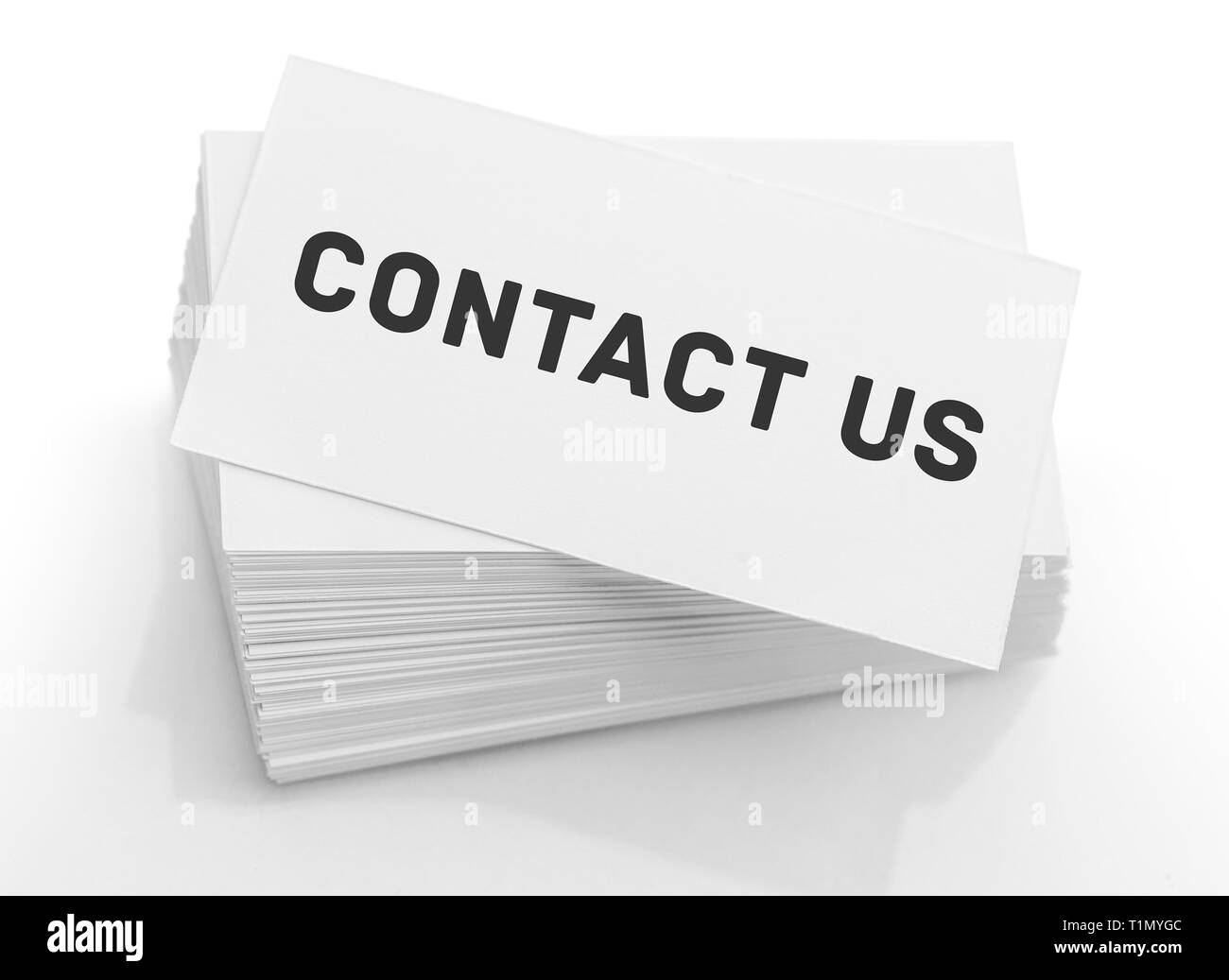 Stack of business cards with the text: contact us Stock Photo