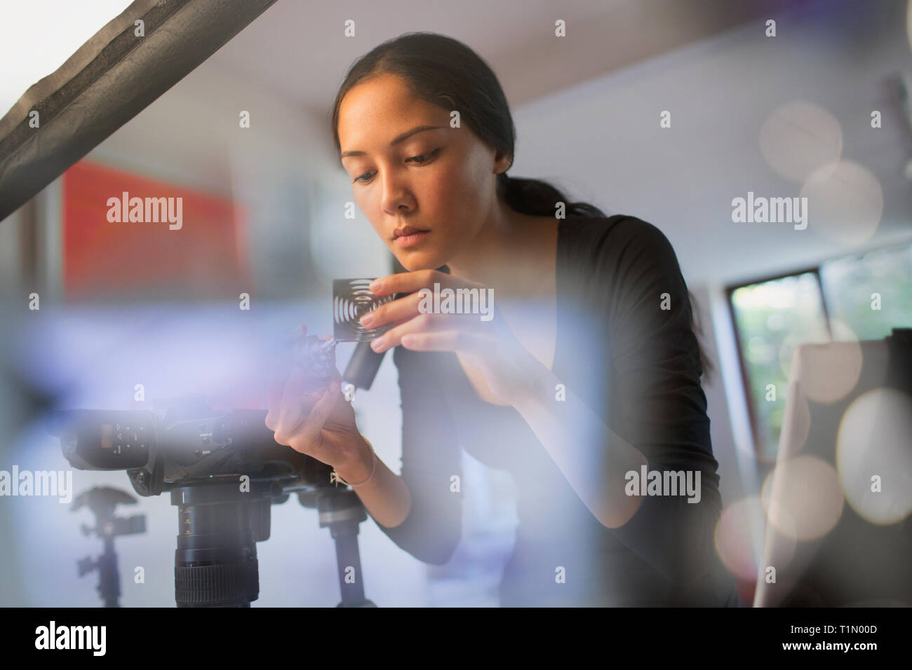 Female photographer working in studio Stock Photo