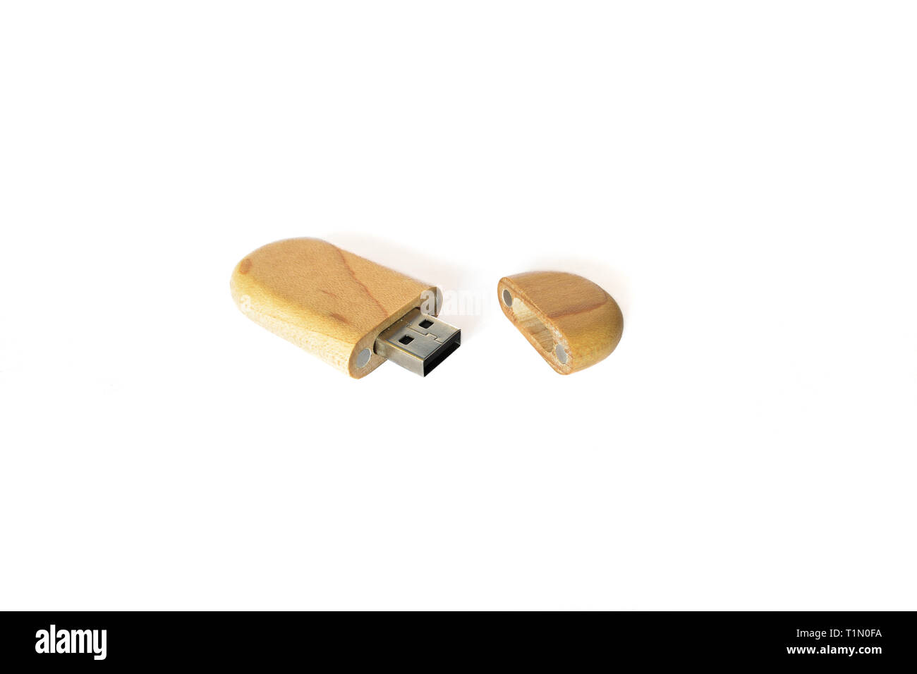 Wooden USB flash memory isolated on a white background, modern combination of technology and natural materials Stock Photo