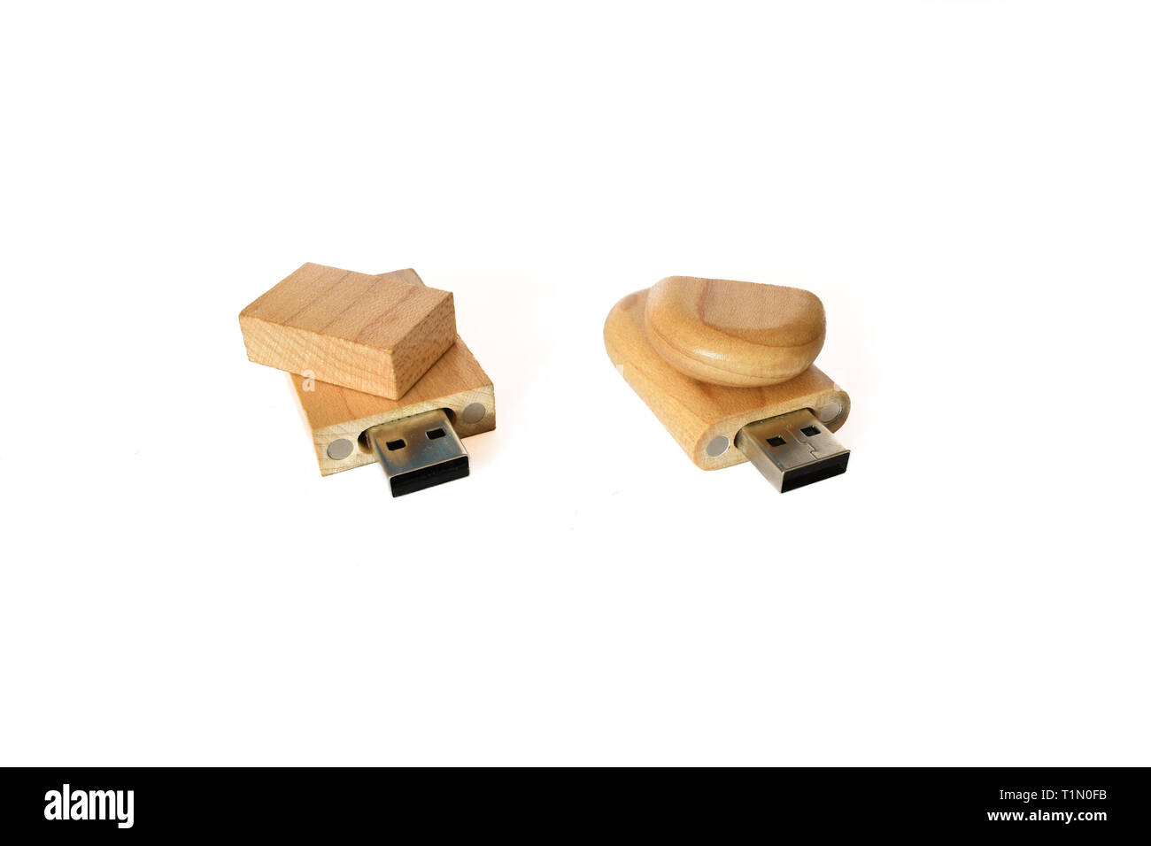 Two wooden USB flash memory isolated on a white background, modern combination of technology and natural materials Stock Photo