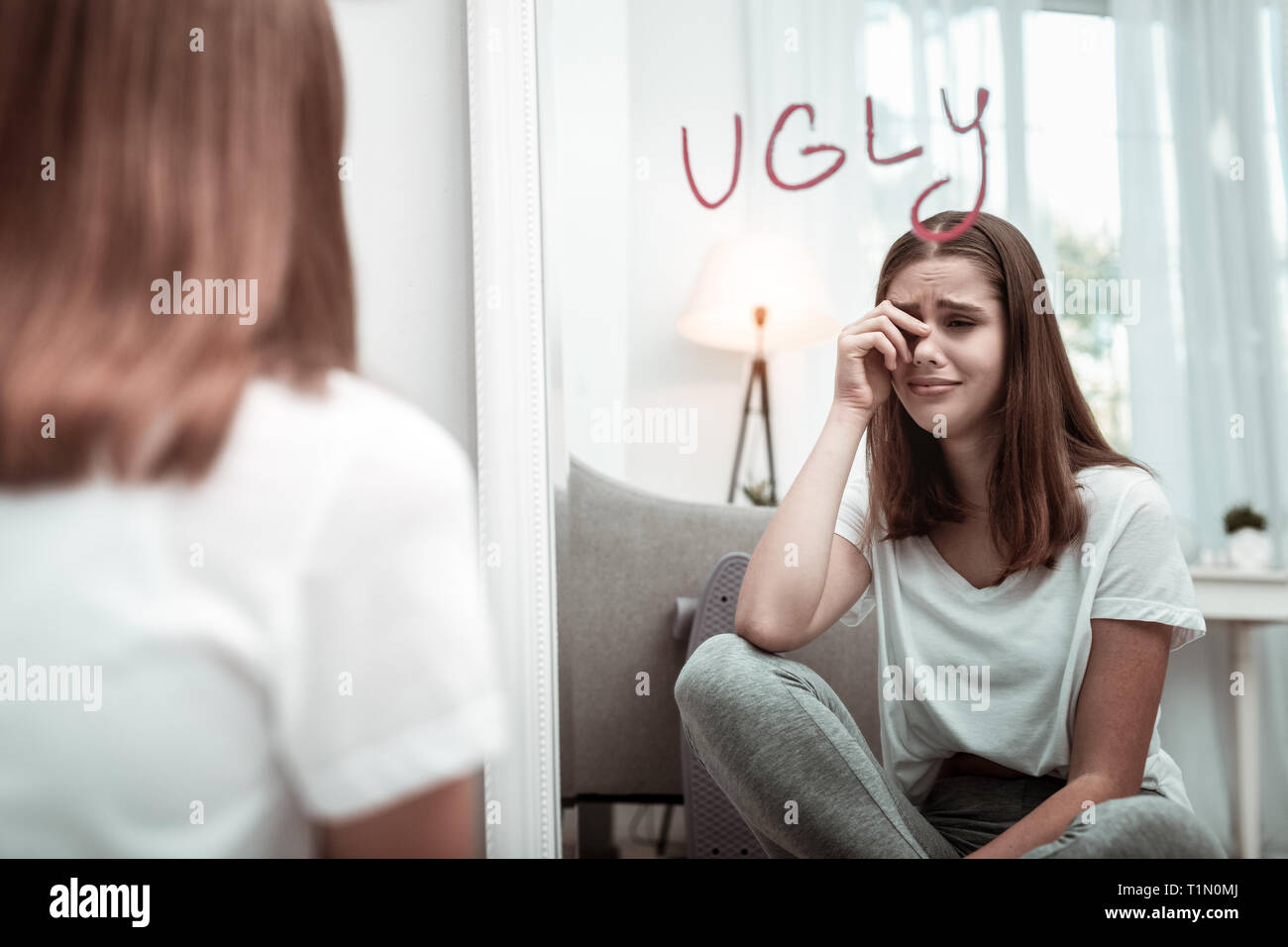 Woman feeling depressed because of feeling ugly Stock Photo Alamy