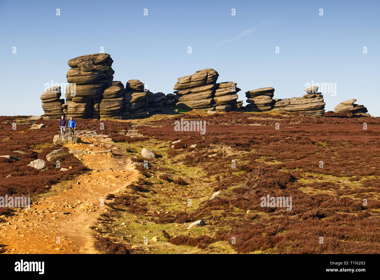 On the path to Wheel Stones (aka Coach & Horses), a weird rock formation at Derwent Edge in the English Peak District, UK Stock Photo