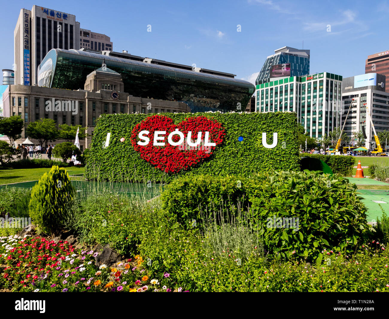 Seoul, South Korea - June 3, 2017: Big flowerbed with inscription against the background of a red heart: ' I seoul u' near Gwanghwamun Square in Seoul Stock Photo