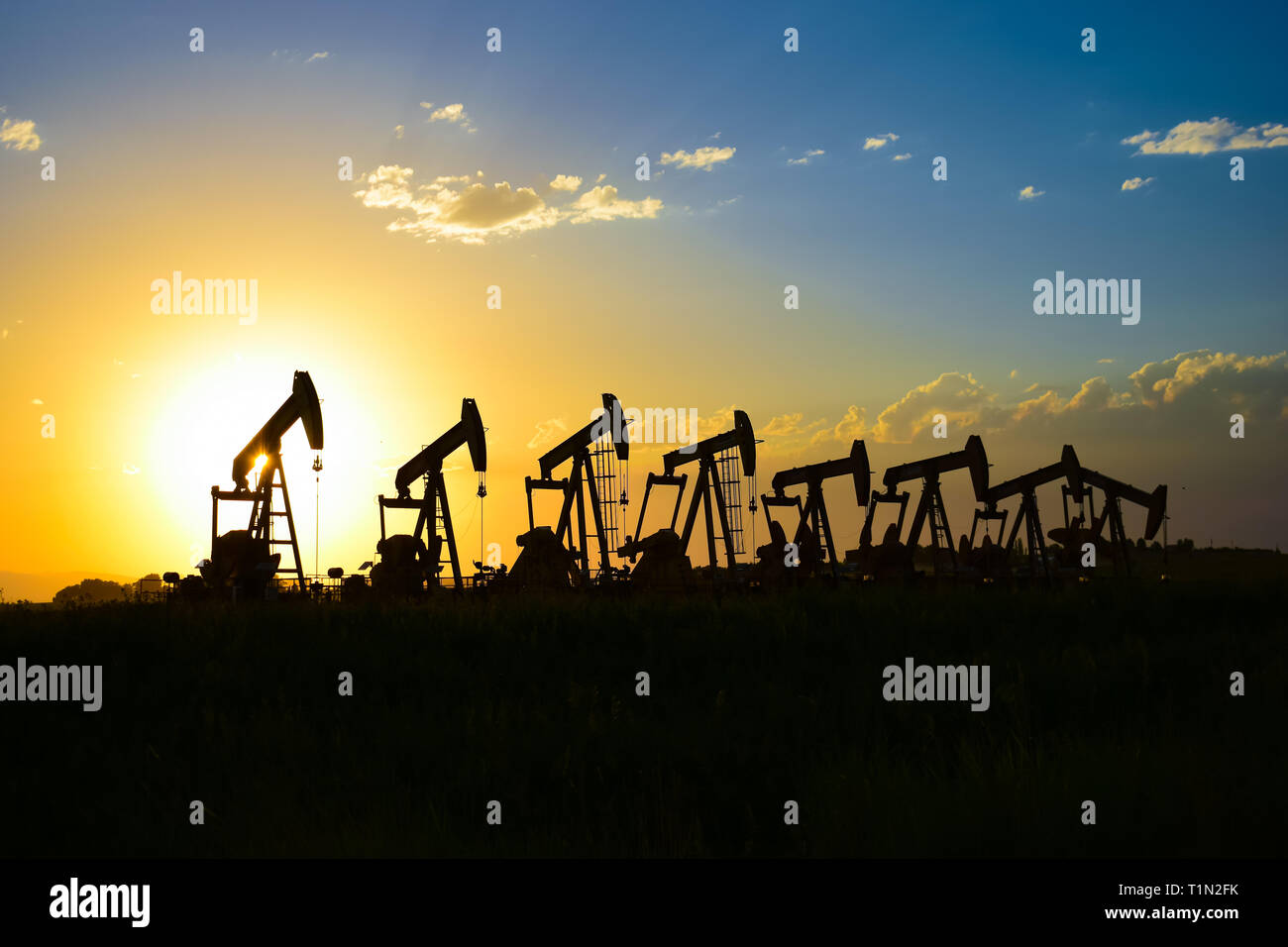 Oil well Pumpjack at Sunset Stock Photo Alamy