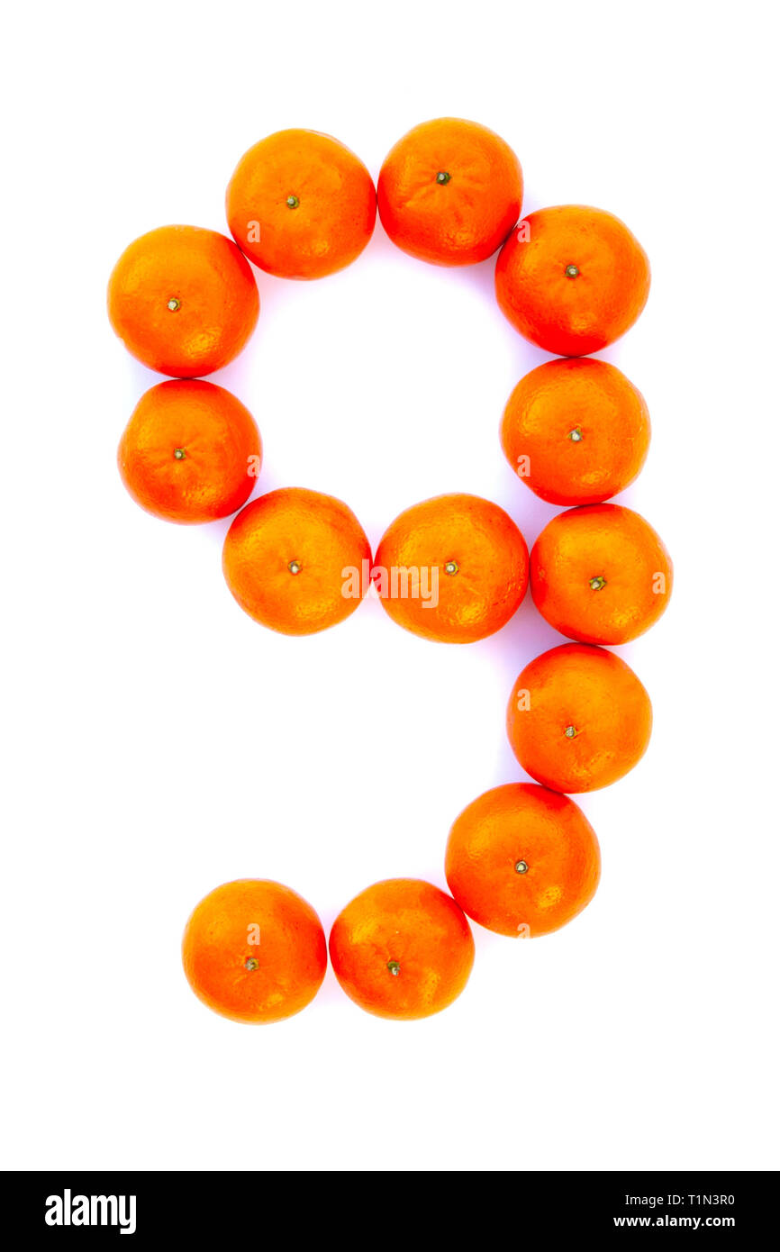 Number solved with tangerines isolated on white background. Mandarine