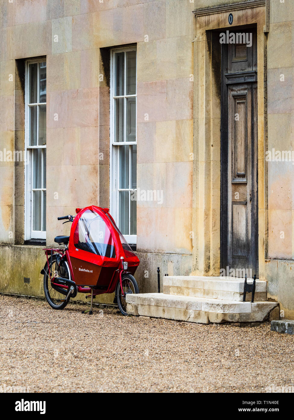 Cambridge Cycling Cargo Bike outside college buildings at Downing College part of the University of Cambridge UK. Downing College was founded in 1800. Stock Photo