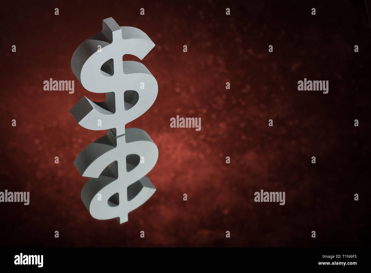 American Currency Symbol or Sign Dollar With Mirror Reflection on Red Dusty Background Stock Photo