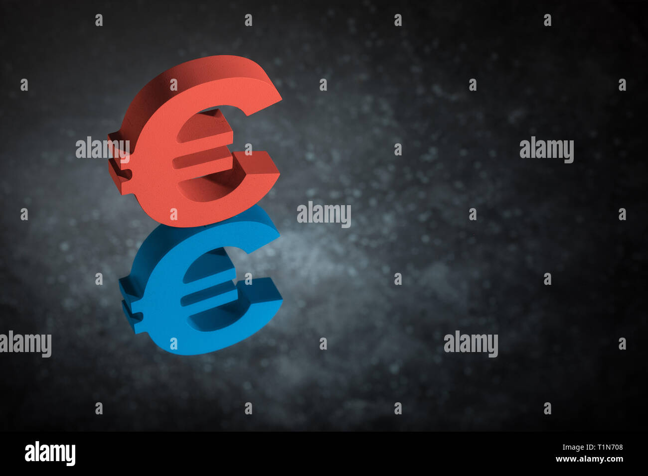 Red and Blue European Currency Symbol or Sign Euro With Mirror Reflection on Dark Dusty Background Stock Photo