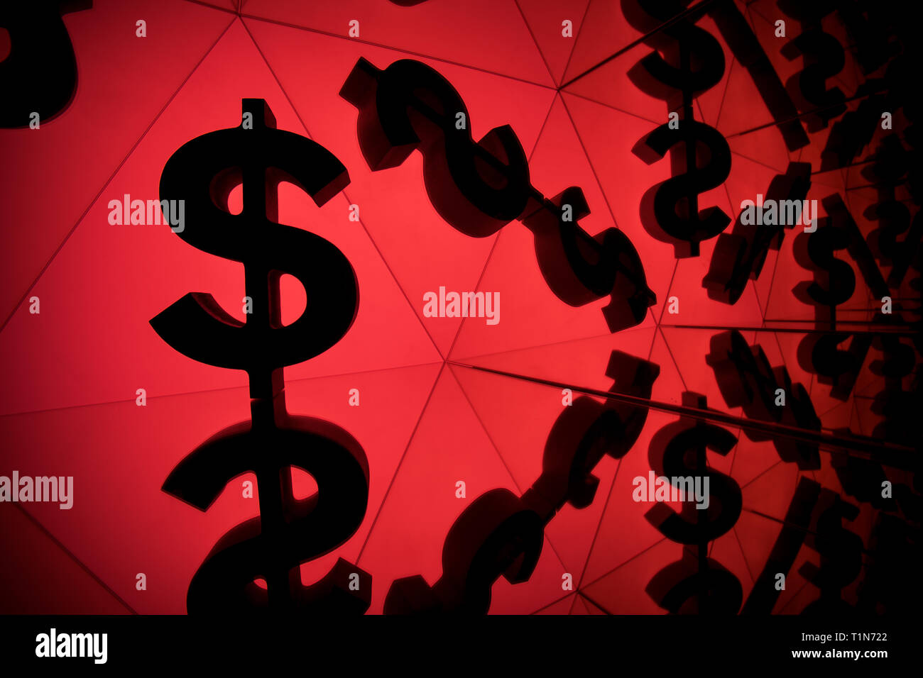 Dollar Currency Symbol With Many Mirroring Images of Itself on Red Background Stock Photo