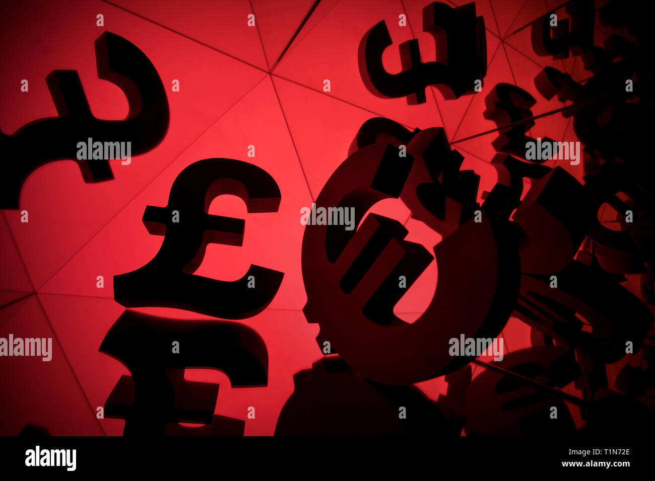 Euro Currency Symbol With Many Mirroring Images of Itself on Red Background Stock Photo