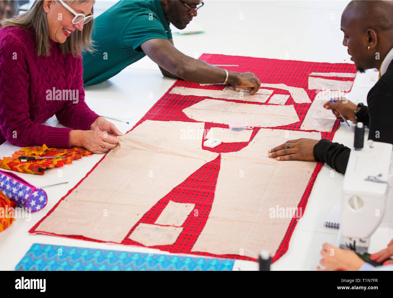 Fashion designers assembling sewing pattern Stock Photo Alamy
