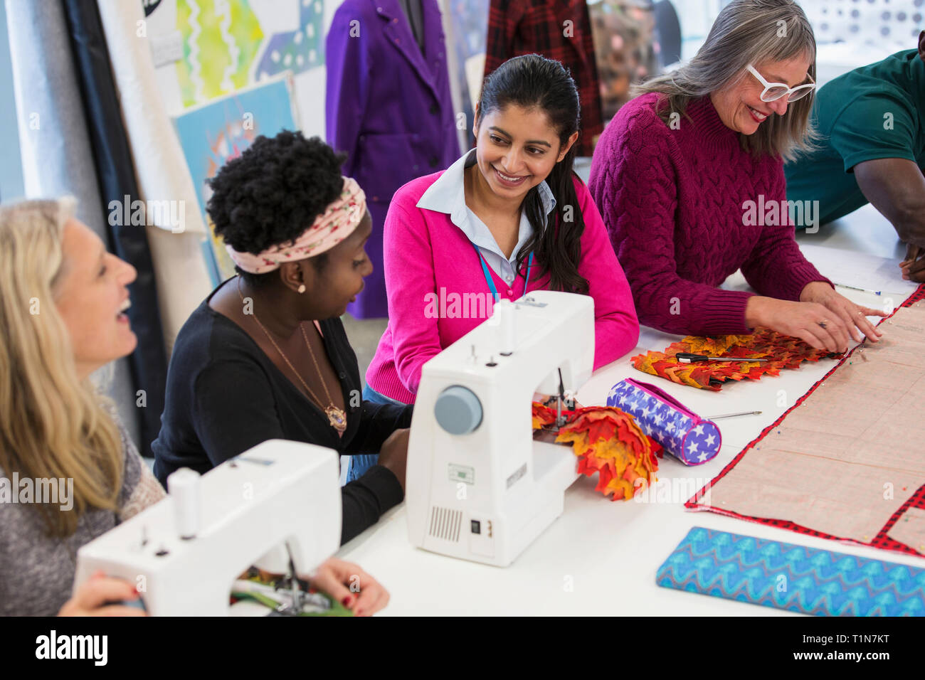 Fashion designers using sewing machines Stock Photo