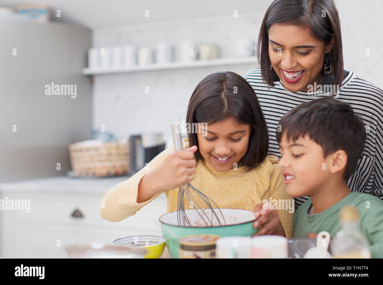 Family baking in kitchen Stock Photo