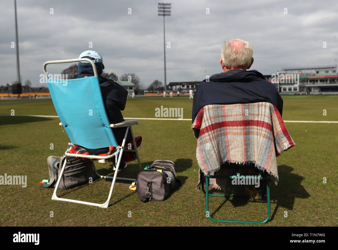 Spectators watch the action during day two of the England MCC University match at Grace Road, Leicestershire. Stock Photo