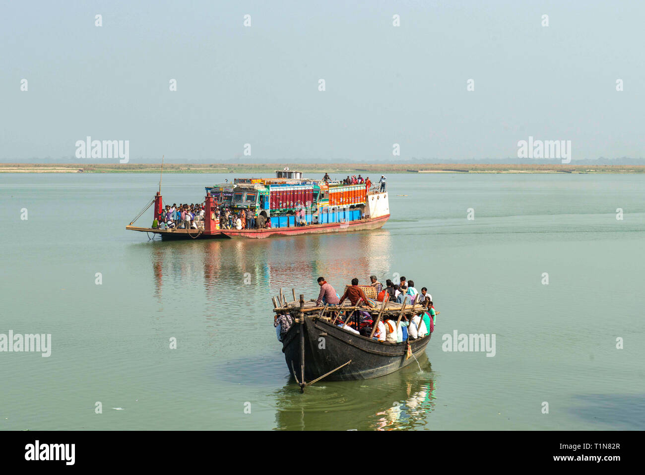 RAJMAHAL, BIHAR, INDIA. December 03-2015. Small and big ferries meeting on river Ganges while crossing between Rajmahal Bihar and Manikchak West Benga Stock Photo