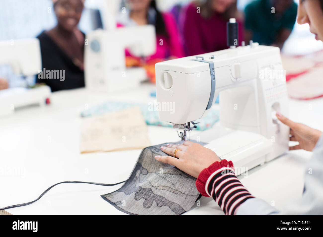 Female fashion designer working at sewing machine Stock Photo Alamy
