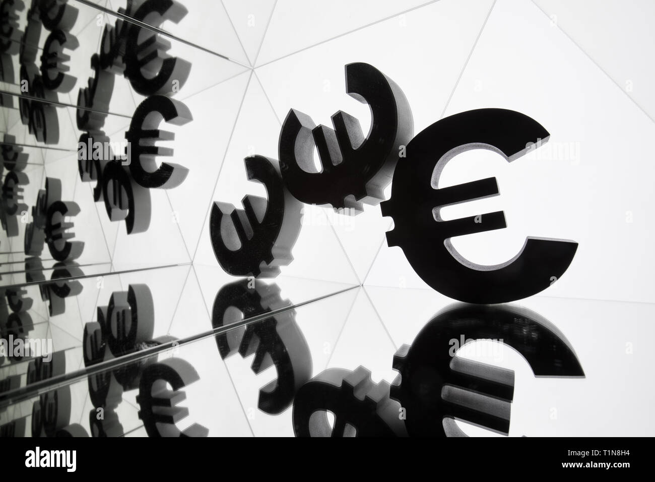 Euro Currency Symbol With Many Mirroring Images of Itself on White Background Stock Photo