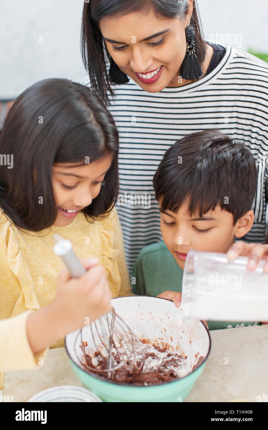 Mother and children baking Stock Photo