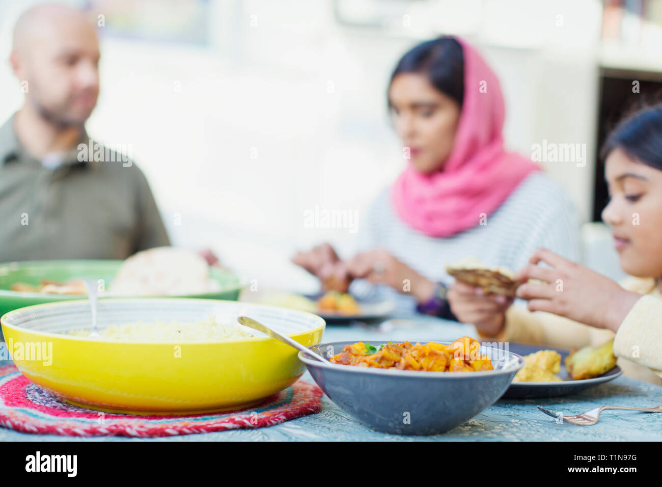 Family eating dinner at table Stock Photo