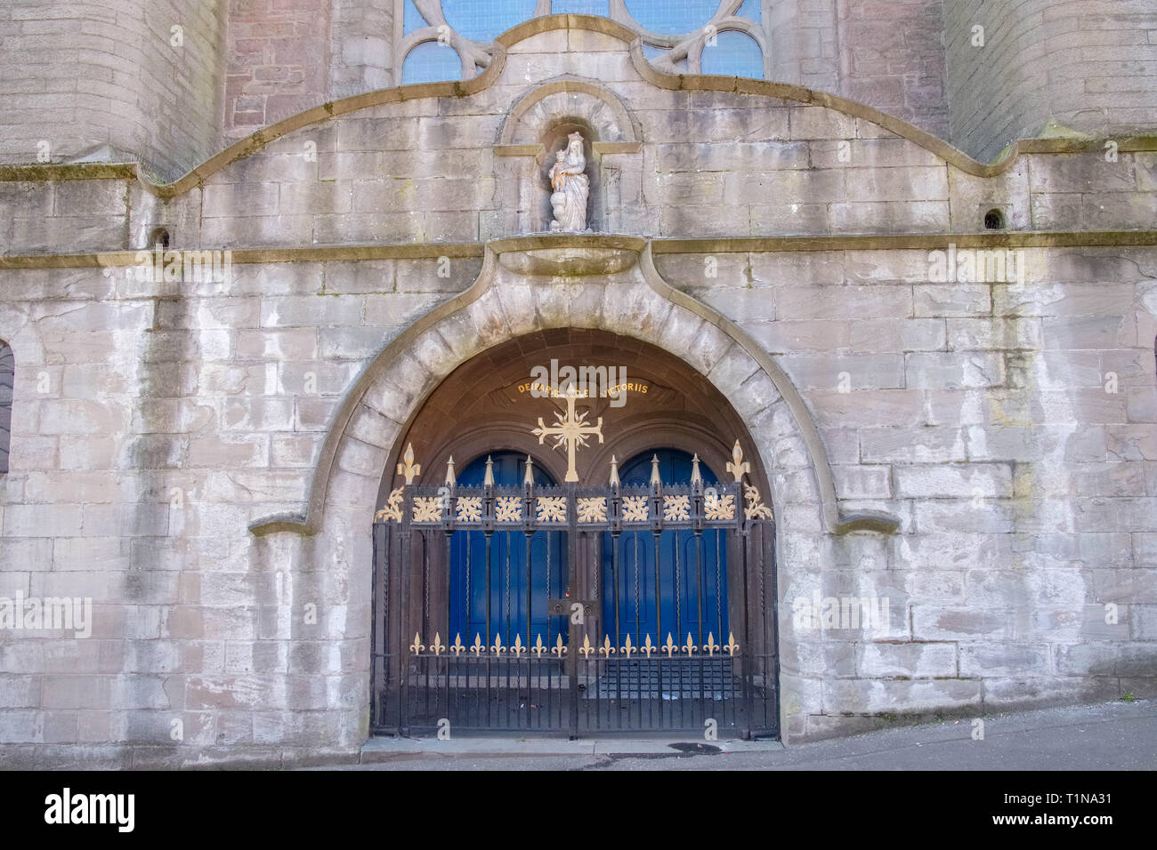 Dundee, Scotland, UK - March 23, 2019:The impressive front entrance to St Mary Our Lady of Victories Catholic Church with its gothic iron gates and st Stock Photo