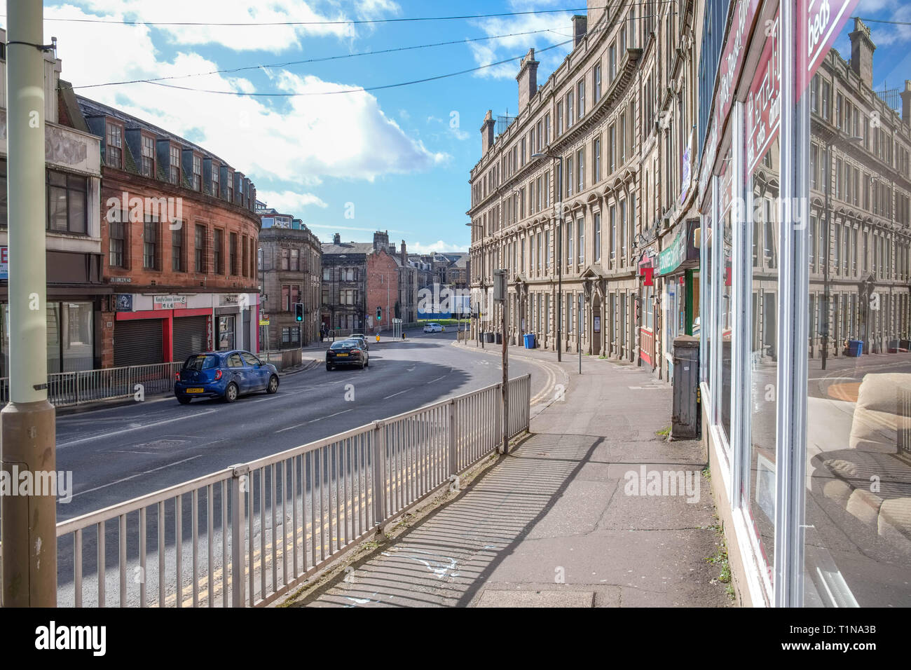 Dundee, Scotland, UK - March 23, 2019: Looking down Victoria Road in Dundee with its impressive traditional buildings situated in the old part of the  Stock Photo