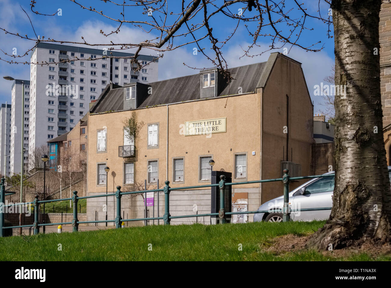 Dundee, Scotland, UK - March 23, 2019: The little theatre situated in Victoria Road Dundee Scotland with the modern multi-story properties overlooking Stock Photo