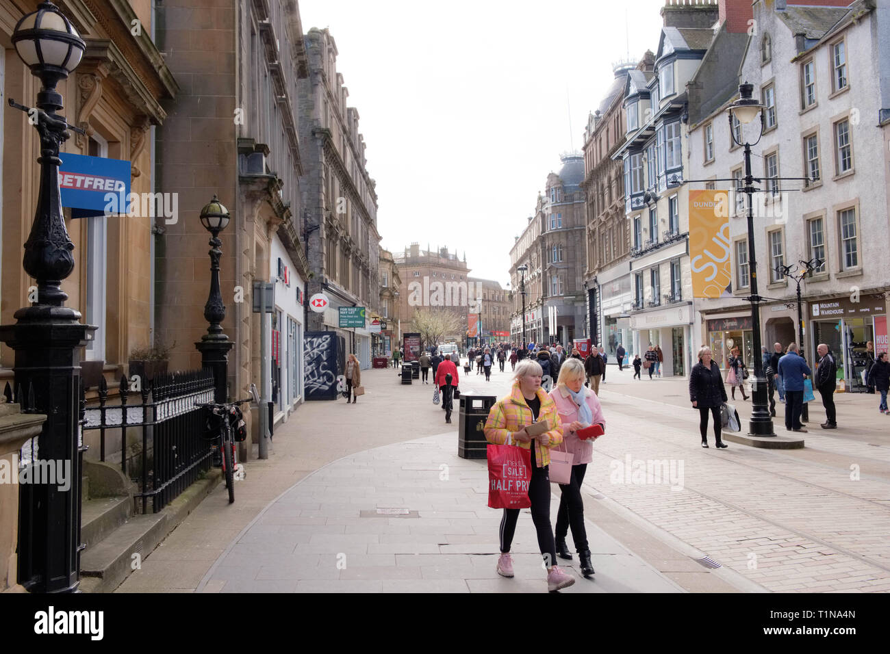 Dundee, Scotland, UK - March 23, 2019: People busy shopping looking down from Wellgate in the City Centre of Dundee in Scotland where empty shop premi Stock Photo