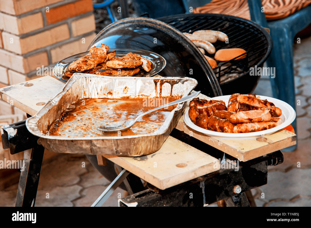 Barbecue in the summer garden. Teal and orange photo filter. Stock Photo