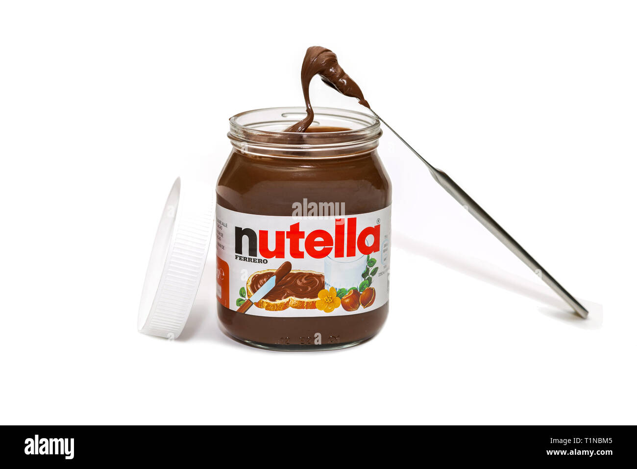 jar of chocolate nutella cream with knife on grey background Stock Photo -  Alamy