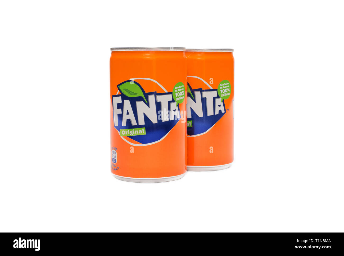 Naples,Italy - 21 march 2018: little cans of Fanta orange soft drink on white background and  fresh raw oranges. Stock Photo