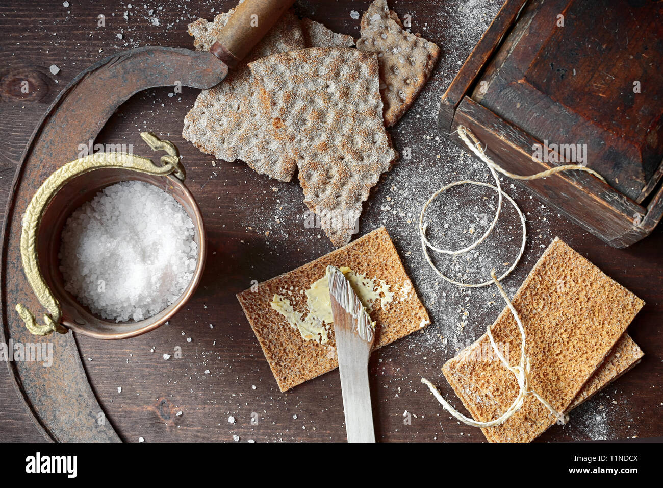 Salt Sickle Rye crackers, wooden knife,old wooden box for lunch, old rusty sickle ...