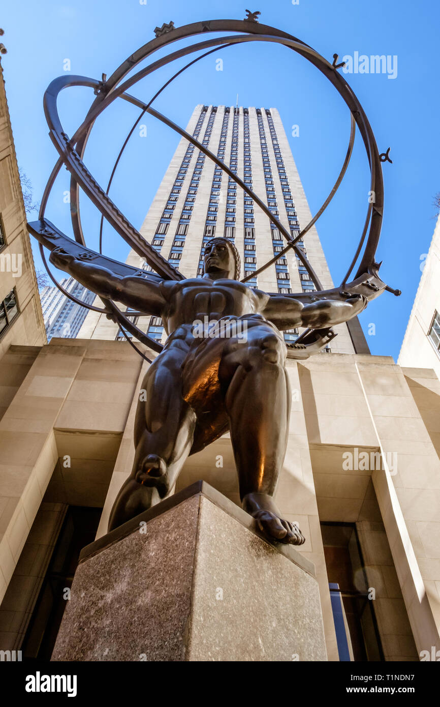 Bronze statue Atlas, depicts the Ancient Greek Titan holding the heavens in the forecourt of Rockefeller Center, Midtown Manhattan, New York. Mar 2018 Stock Photo
