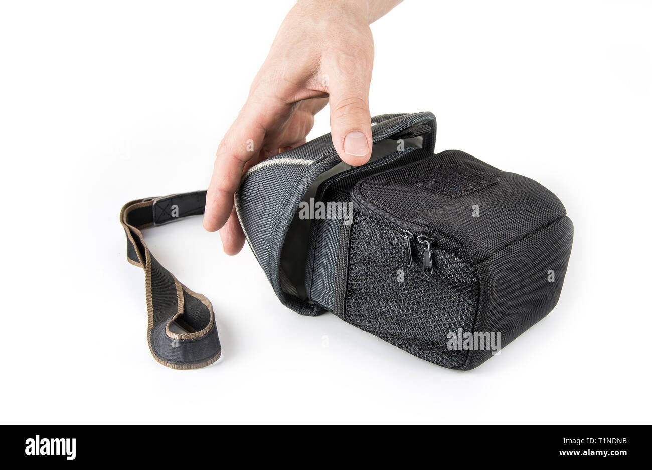 Camera case with a strap in a white Stock Photo
