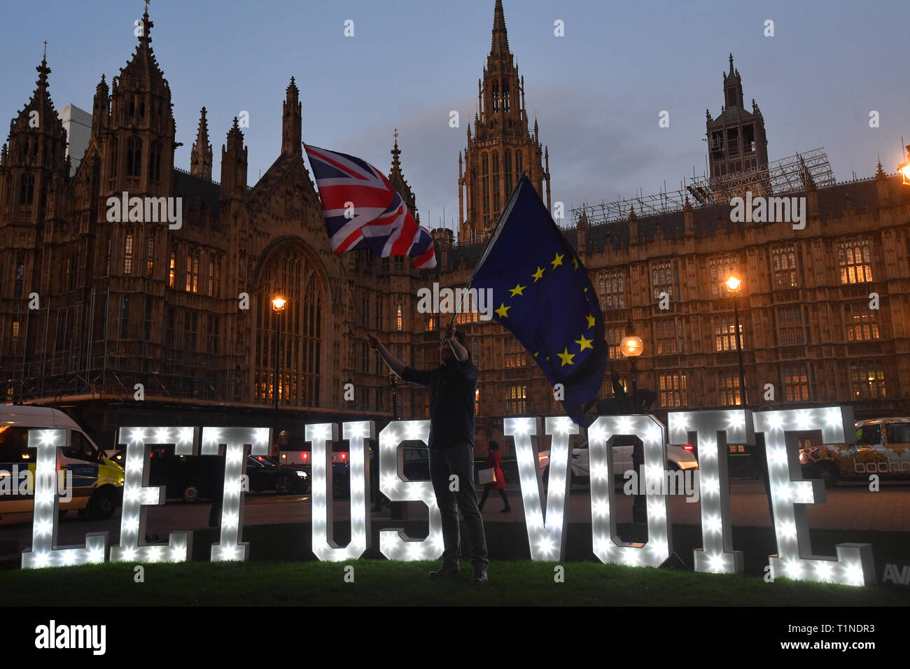 Anti Brexit Protestors With An Illuminated Sign Reading Let Us Vote Outside The Houses Of Parliament London On The Day That Mps Will Be Asked To Consider A Range Of Alternative Brexit Options