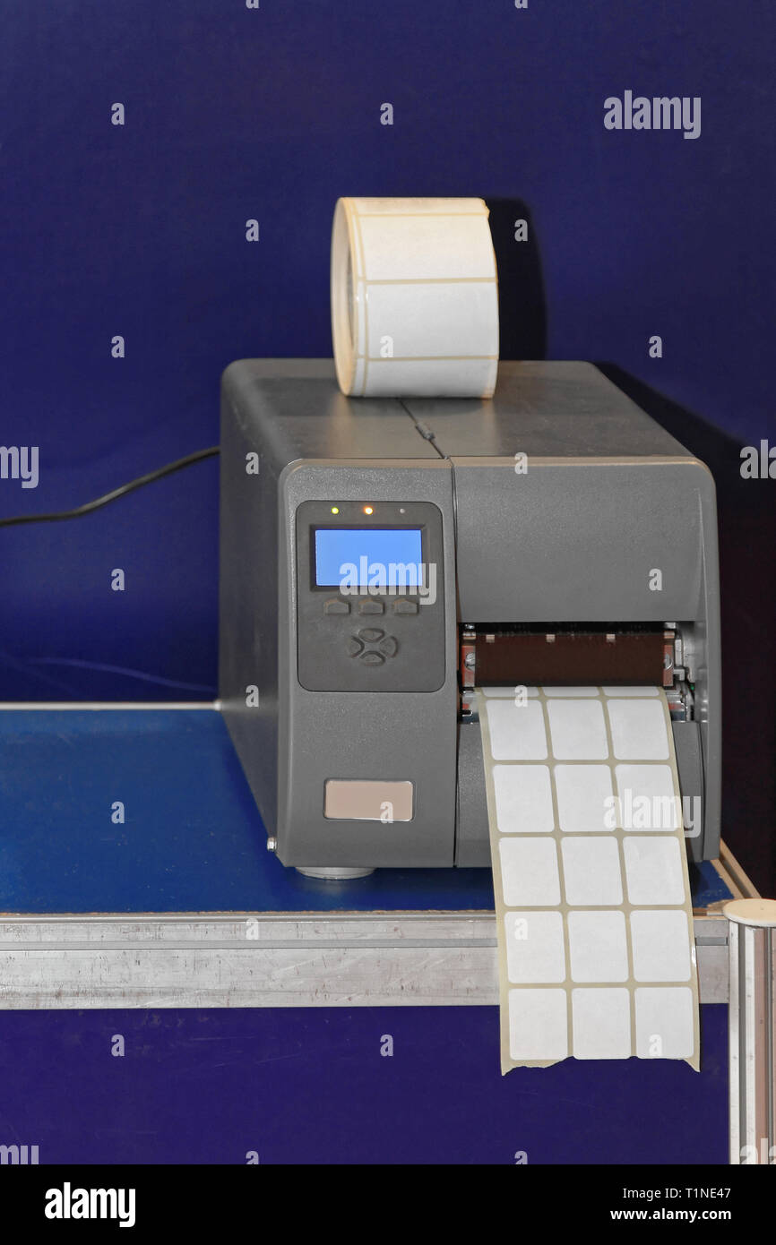 Barcode Label Printer Machine in Warehouse Stock Photo - Alamy
