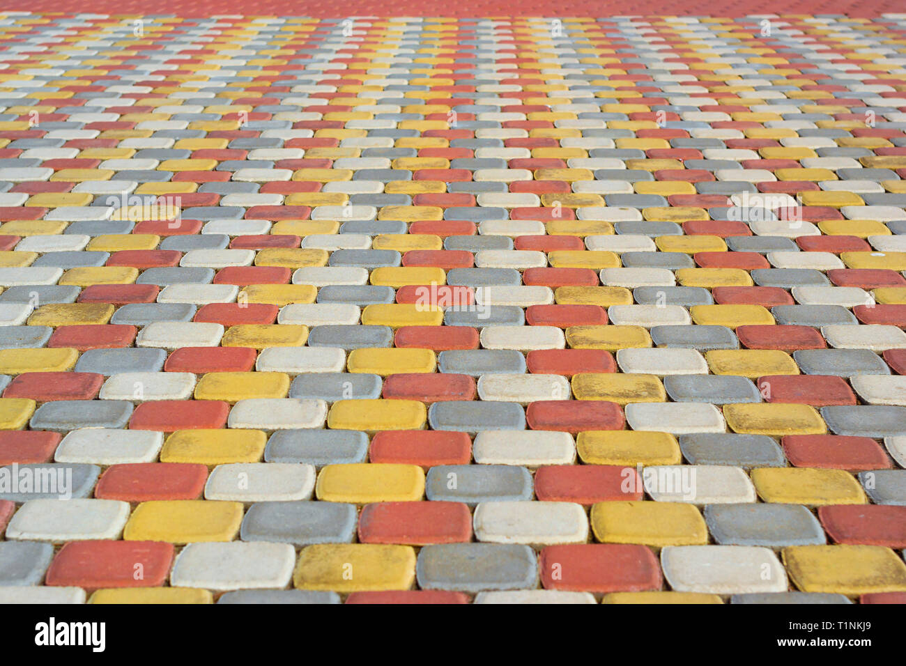 Paving slabs for pedestrian areas. Texture of paving slabs of different colors for the improvement of yards and footpaths Stock Photo
