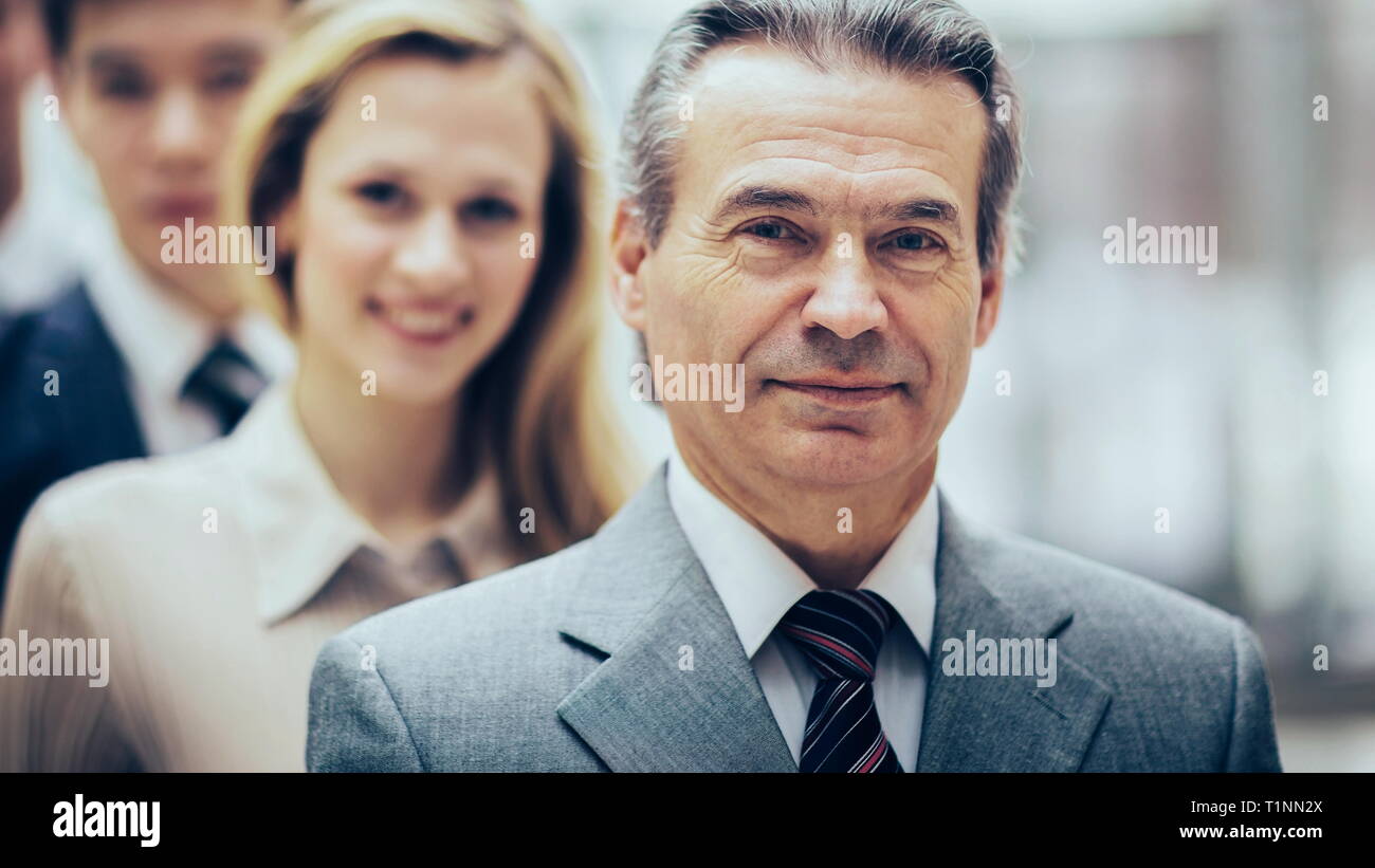 Happy smiling business team standing in the row at office Stock Photo ...