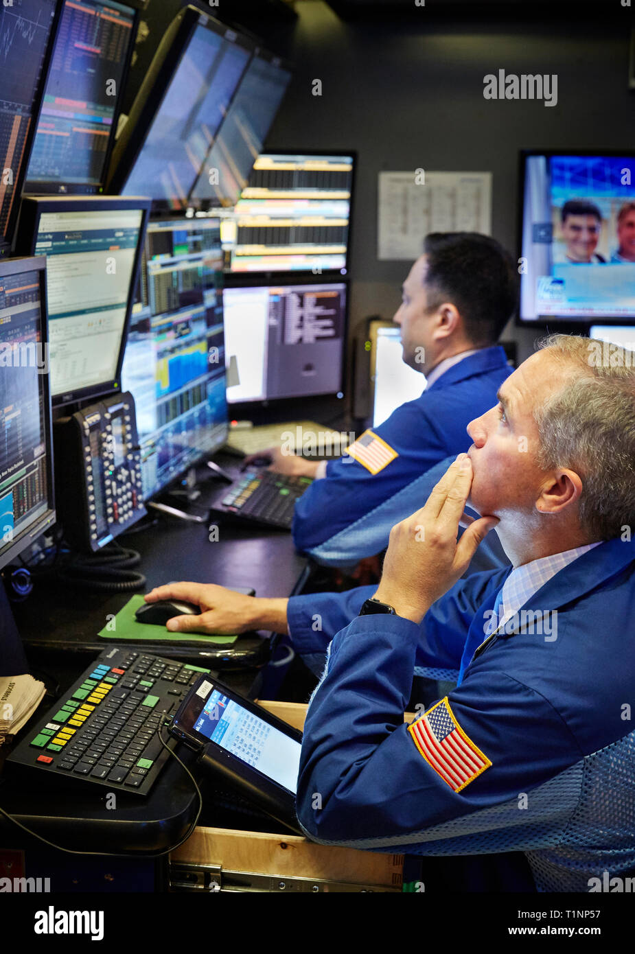 A stock trader on the floor of the New York Stock Exchange NYSE. Stock Photo