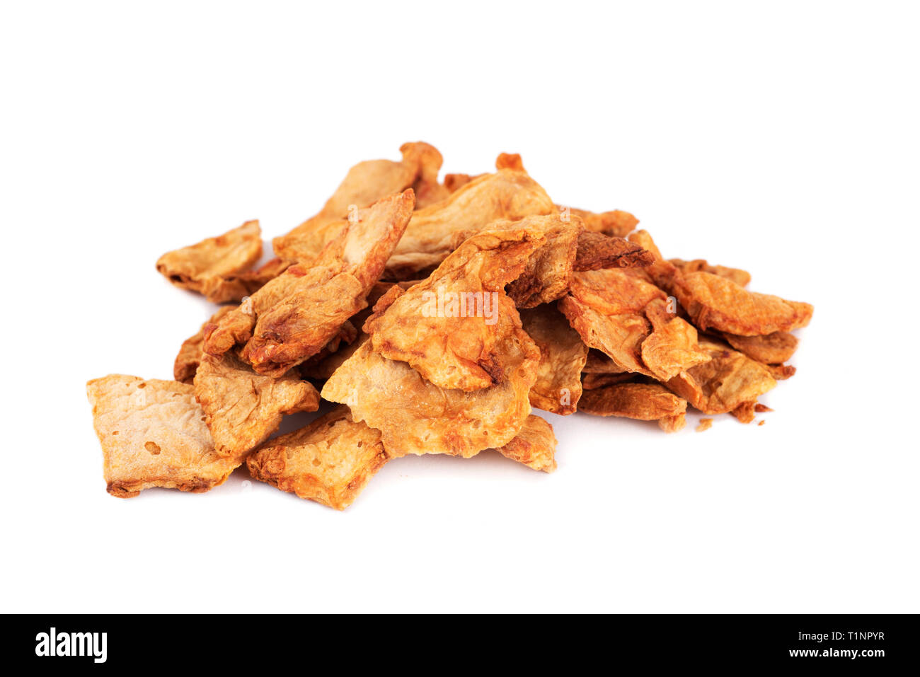 a pile of slices of dried papaya on a white background Stock Photo Alamy