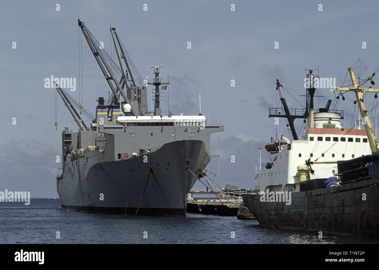 29th October 1993 The huge United States Marine Administration vehicle cargo ship, USNS Denebola, berthed at Mogadishu's port in Somalia. It is in the process of unloading trucks, tanks, various other vehicles and troops. Stock Photo