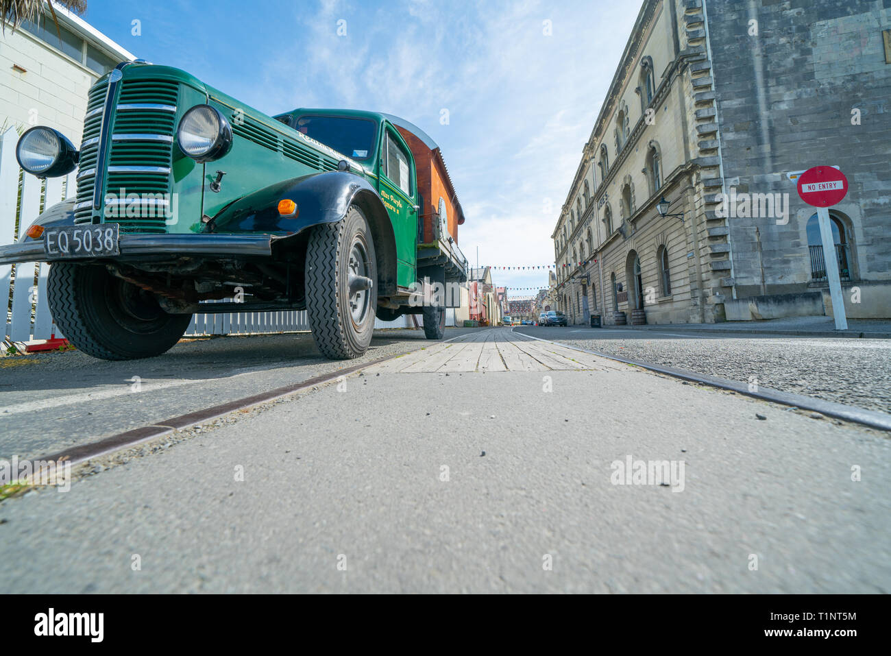 OAMARU NEW ZEALAND - OCTOBER 24 2018; Vintage green Bedford truck Miss Purple or Realm Runner converted to house-truck paked on side of intersetction  Stock Photo